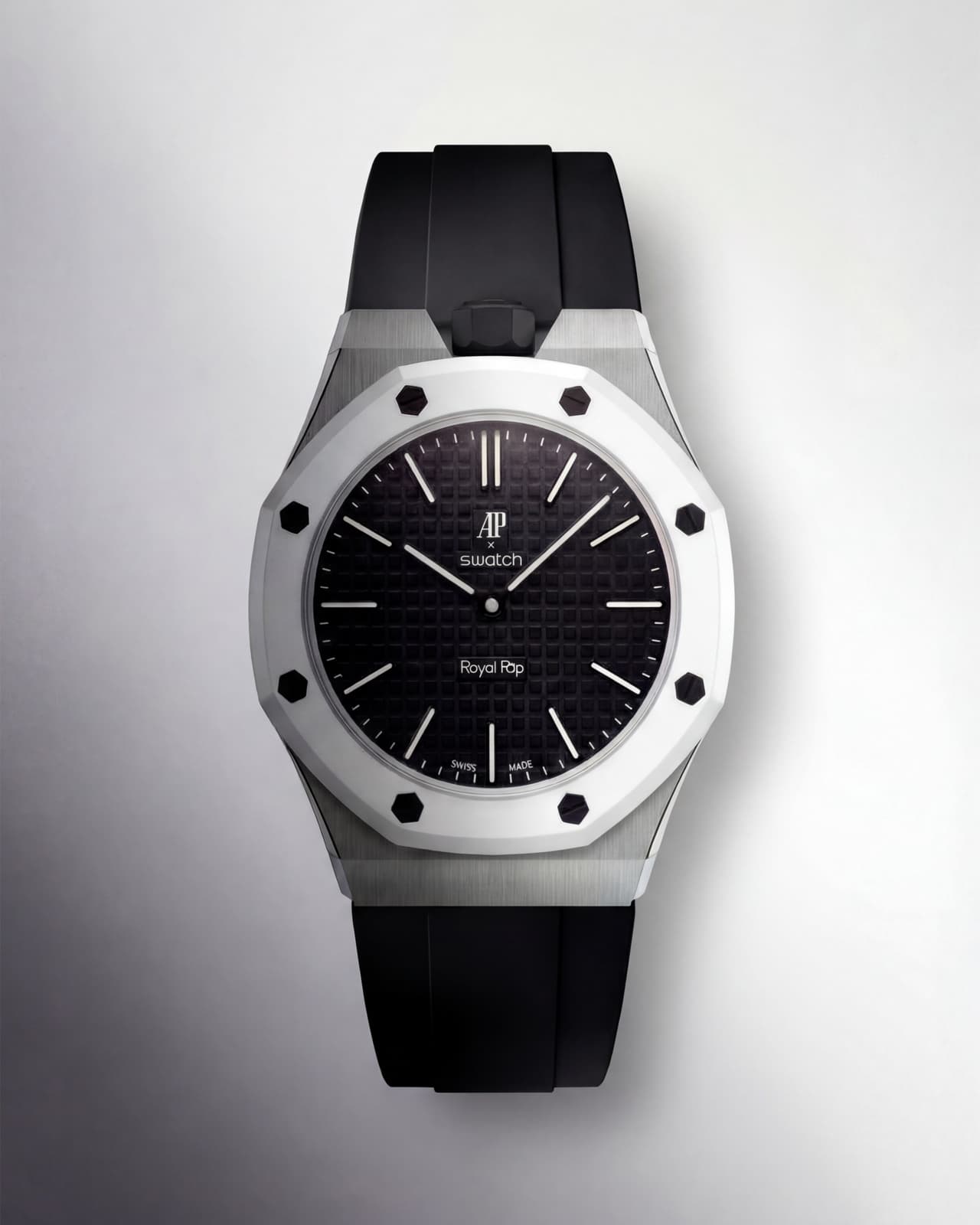 Steel Panda edition: AP × Swatch Royal Pop with white ceramic bezel and black silicone strap, photographed against a soft grey gradient.